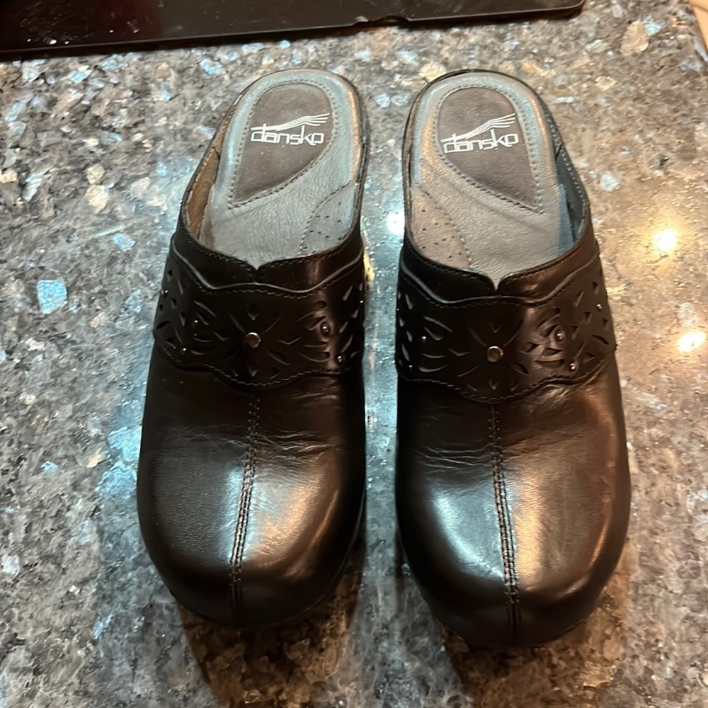 Brand new never worn Dansko clogs rubber sole.